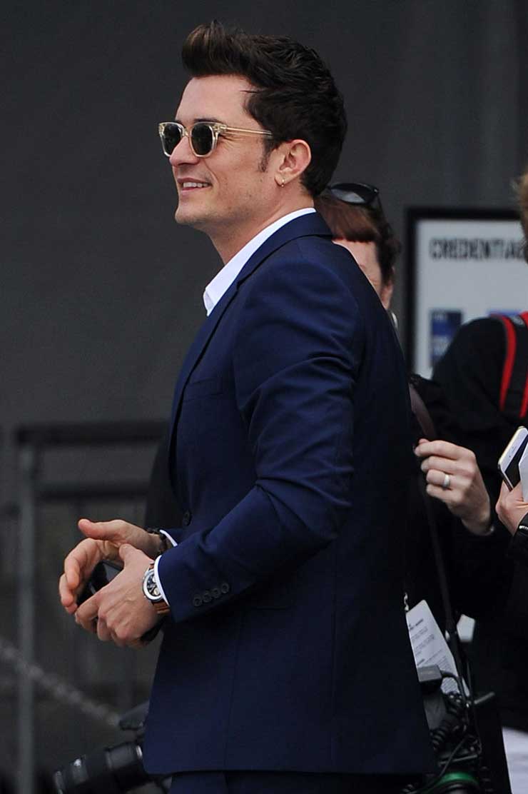 Orlando Bloom shows off his earring in stylish Oliver Peoples sunglasses, LA