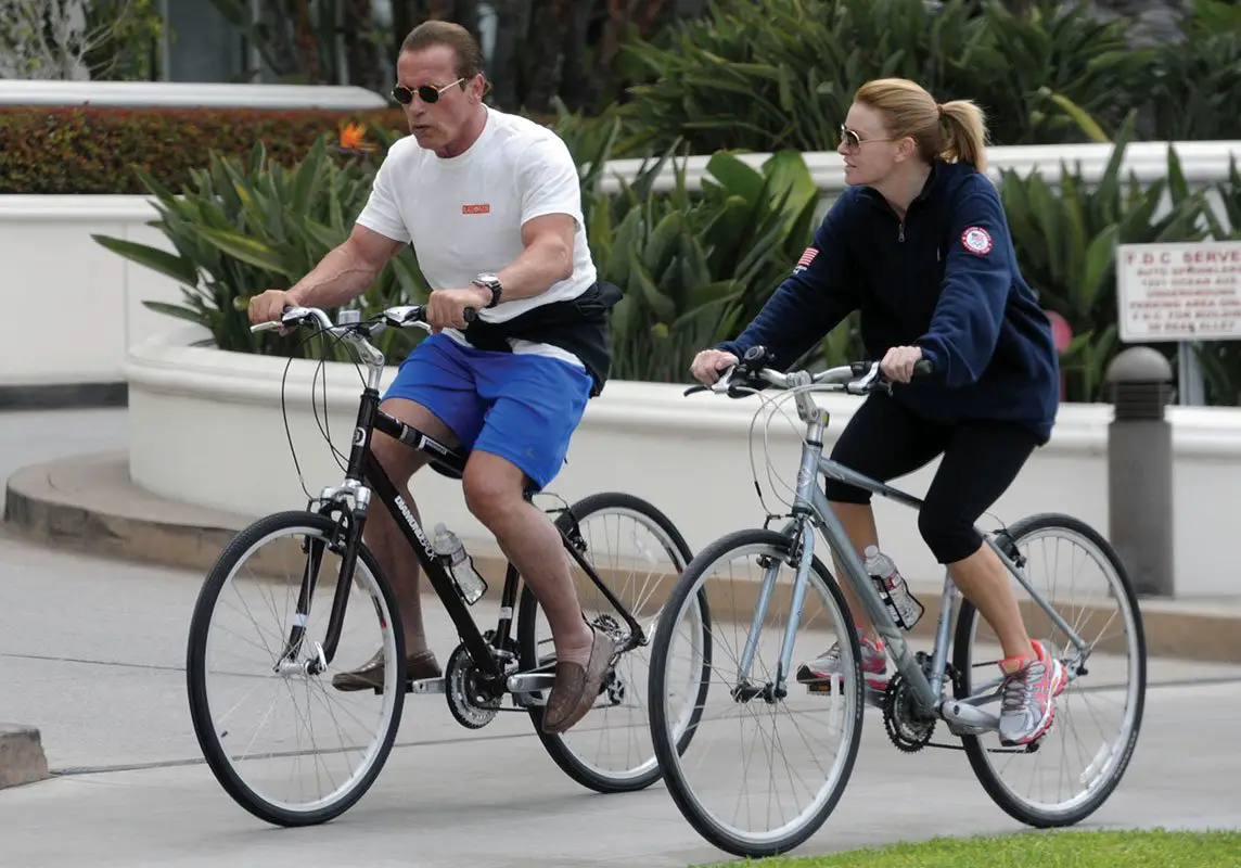 Arnold Schwarzenegger and Heather Milligan enjoy a bike ride together in LA © Atlantic Images