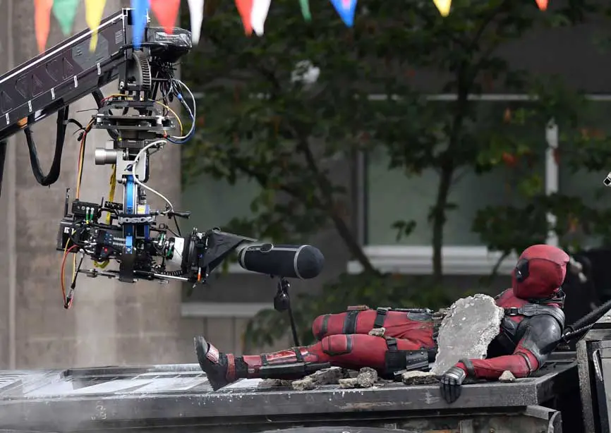 Deadpool up to more mischief on the film set of Deadpool 2 but pictured lying under some concrete