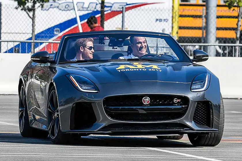 Prince Harry looked to be enjoying the ride on the sporty Jag