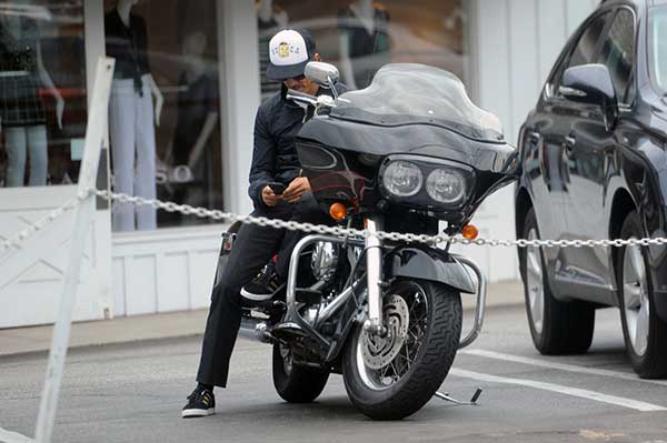 Anthony Kiedis checked his messages as he arrived on his Harley Davidson bike
