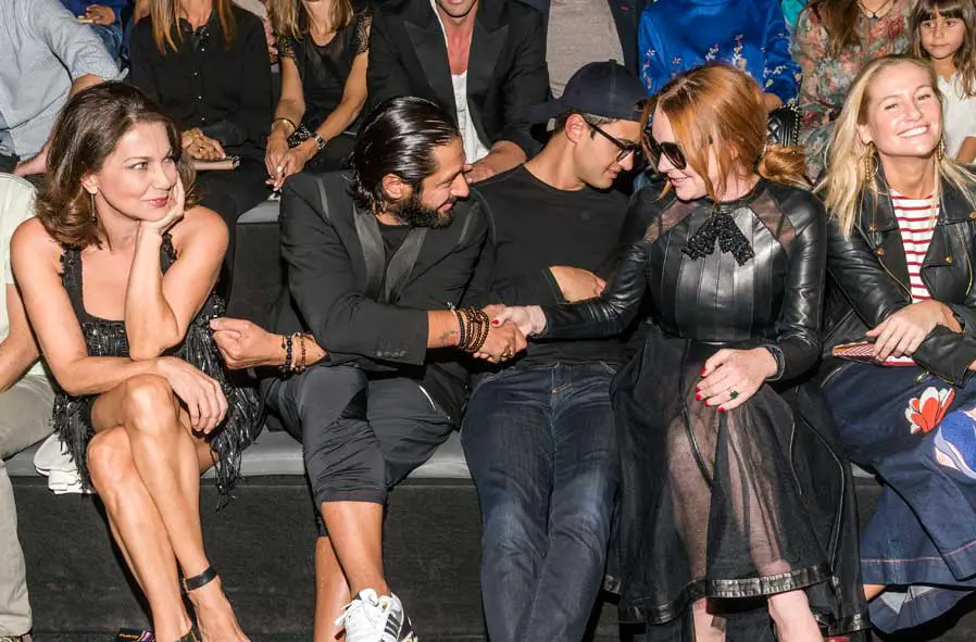 Lindsay Lohan was very polite and wore a see-through leather dress to the Mercedes Benz Fashion Week Madrid and sat next to publicist / manager Scott Carlsen - Photo Courtesy of Image.net / Atlantic Images