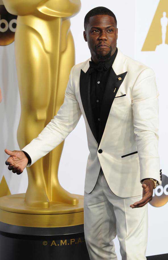 Kevin Hart pictured in a white suit at the Oscars © Atlantic Images