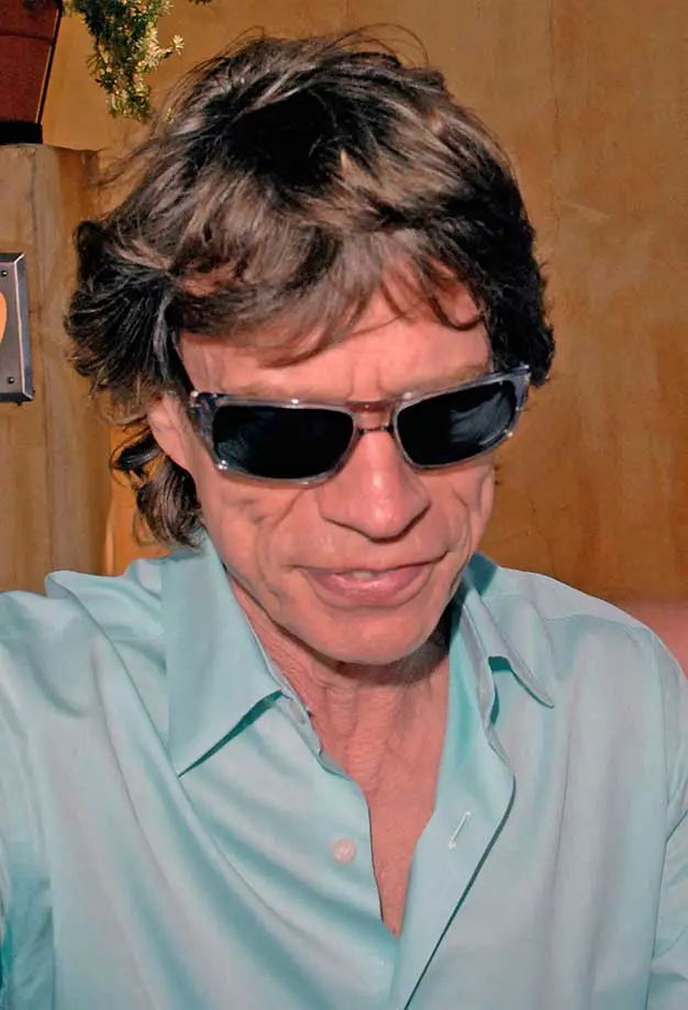 Mick Jagger was rushed out of an LA restaurant wearing some hefty sunglasses and an open shirt