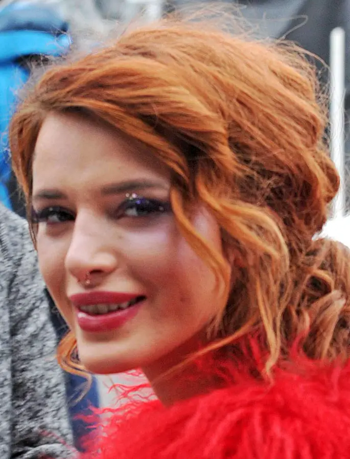 Bella Thorne looked stunning in red and showed off her nose ring eyelashes