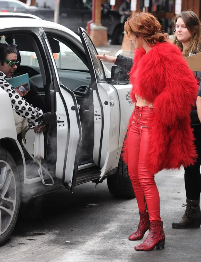 Bella Thorne red outfit Assassination Nation red jeans red fur coat lipstick red hair at Sundance film festival