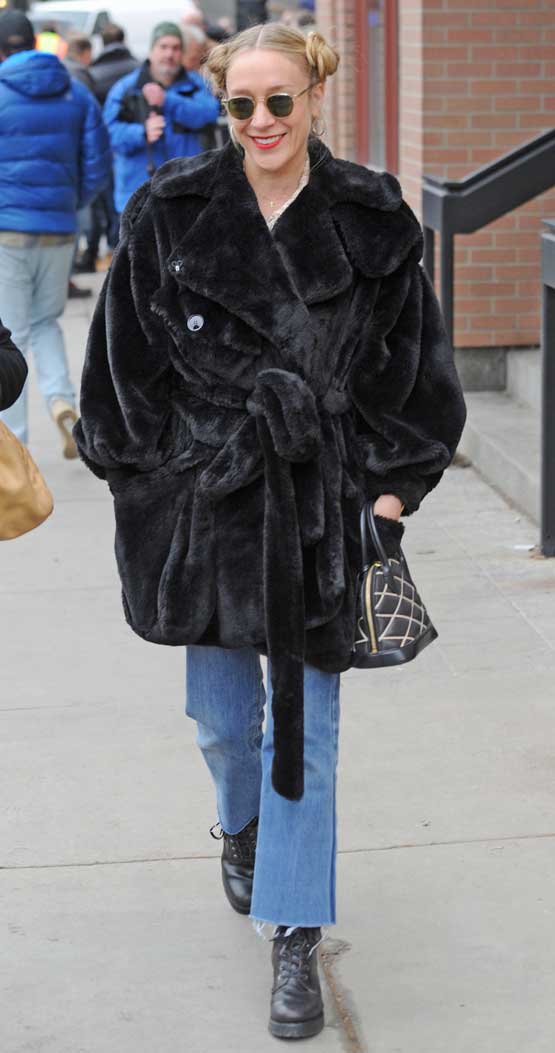 Chloe Sevigny Black Fur Coat Pigtail Buns Sunglasses Promoting Lizzie at Sundance Film Festival in Vintage Denim Jeans