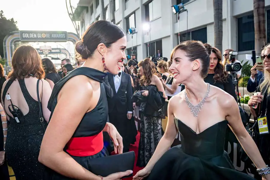 Mandy Moore bumped into Alison Brie on the red carpet with Mandy wearing a black Rosie Assoulin Fall 2017 Gown and Alison in a Vassilis Zoulias number © HFPA