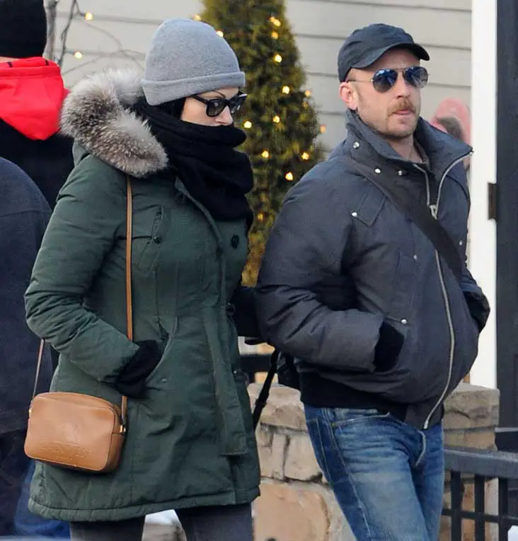 Laura almost went incognito wearing wayfarers and her scarf covering her face walking with Fiance Ben Foster