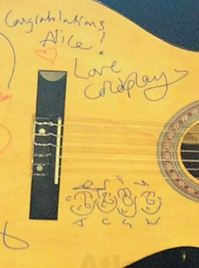 Chris Martin signed Coldplay guitar with cartoon caricatures drawn on at the BBC Radio 1 Teen Awards
