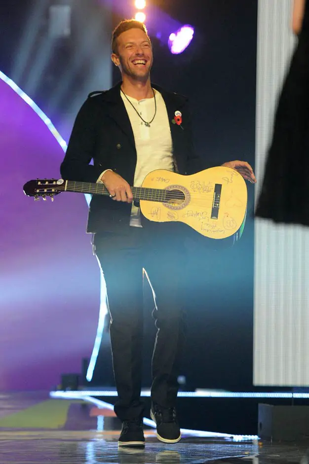 Chris Martin signed Coldplay guitar with cartoon caricatures drawn on at the BBC Radio 1 Teen Awards