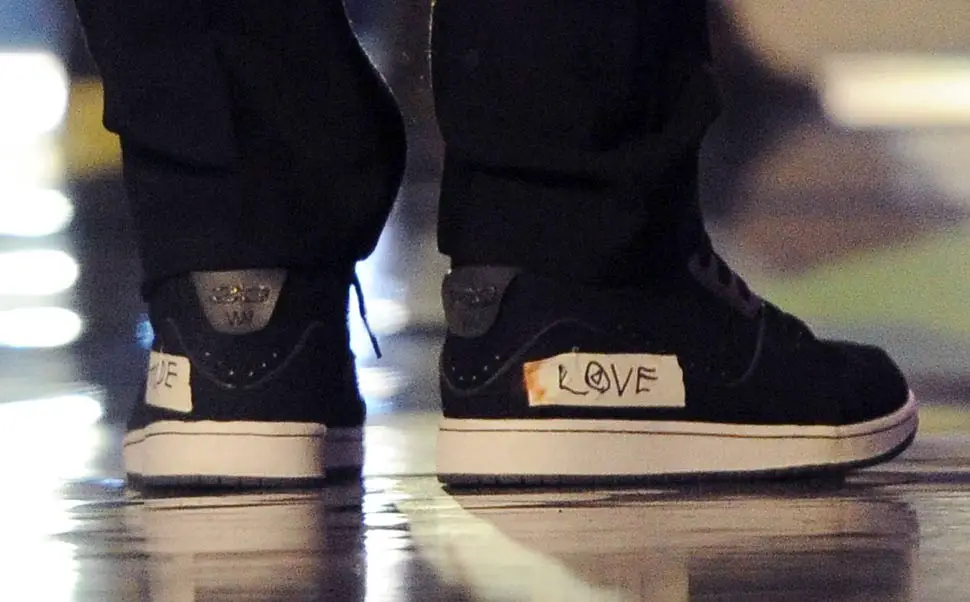 Chris Martin had the word "LOVE" taped to his sneakers