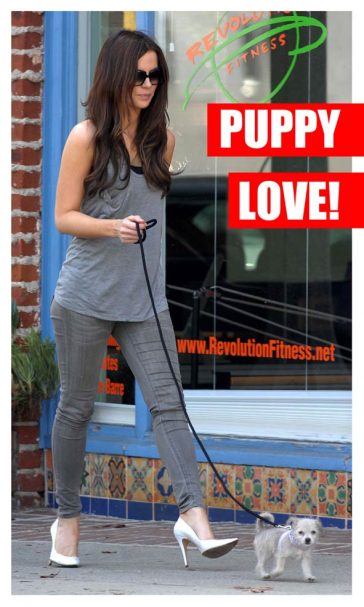 Kate Beckinsale walking Puppy dog Ingrid Wearing Heels skinny jeans and a vest showing off her fashion in Sunglasses