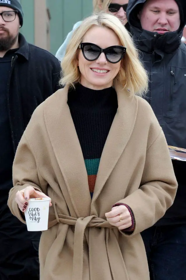 Naomi Watts stepped out in an unusual outfit but also promoted a positive message with her coffee cup reading “Good Vibes Only” Sorel Boot Trenchcoat 2018 sundance Film Festival promoting Ophelia Film