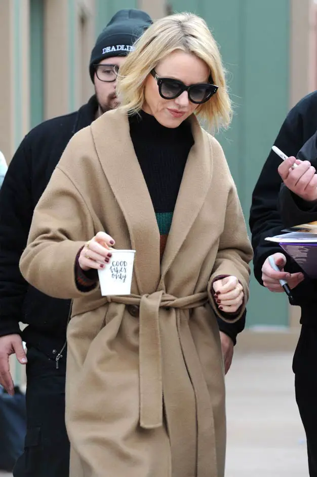 Naomi Watts stepped out in an unusual outfit but also promoted a positive message with her coffee cup reading “Good Vibes Only” Sorel Boot Trenchcoat 2018 sundance Film Festival promoting Ophelia Film