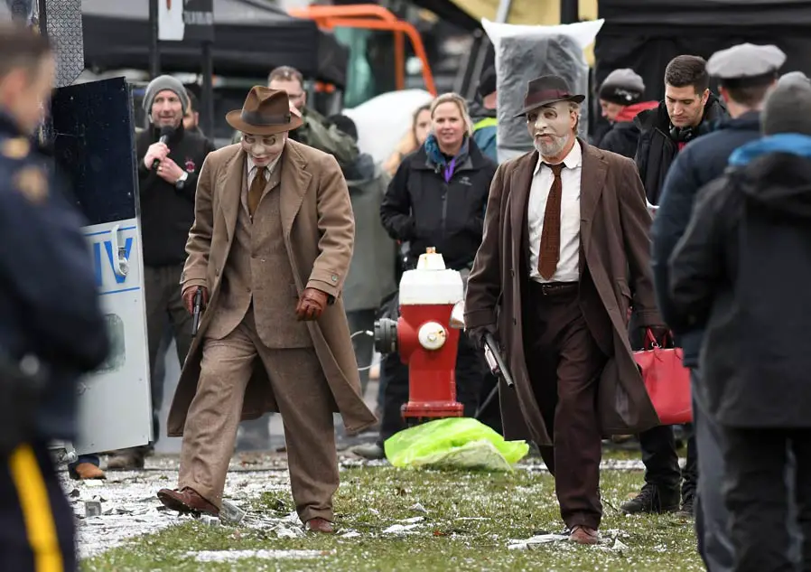 Bad Times At The El Royale Heist Scene Nick Offerman Jeff Bridges Smart Suit Masks Guns