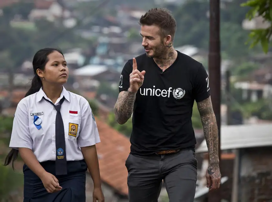 UNICEF Goodwill Ambassador David Beckham walks with Sripun, 15, near her home in Semarang, Indonesia - Photo Courtesy of UNICEF 7: The David Beckham UNICEF Fund