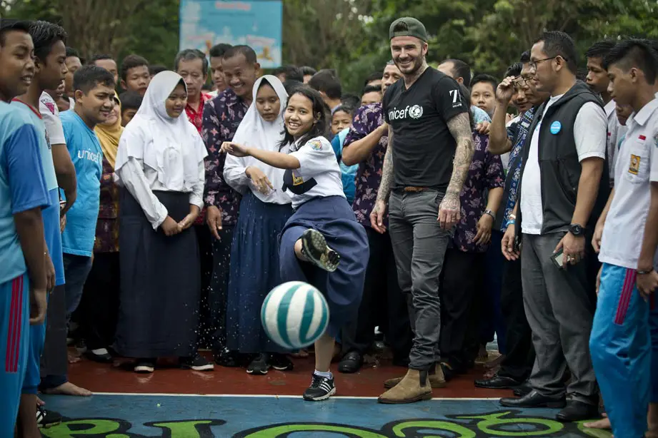 UNICEF Goodwill Ambassador David Beckham plays football with students and teachers at the SMPN 17 school in Semarang, Indonesia - Photo Courtesy of UNICEF 7: The David Beckham UNICEF Fund