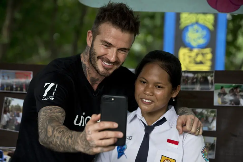 UNICEF Goodwill Ambassador David Beckham takes a selfie with Sripun, 15, at her school in Semarang, Indonesia - Photo Courtesy of UNICEF 7: The David Beckham UNICEF Fund tattoos