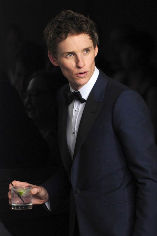 Thirsty work! Eddie Redmayne carried his drink with him after winning the Oscar for Best Actor in a Leading Role for 'The Theory of Everything'