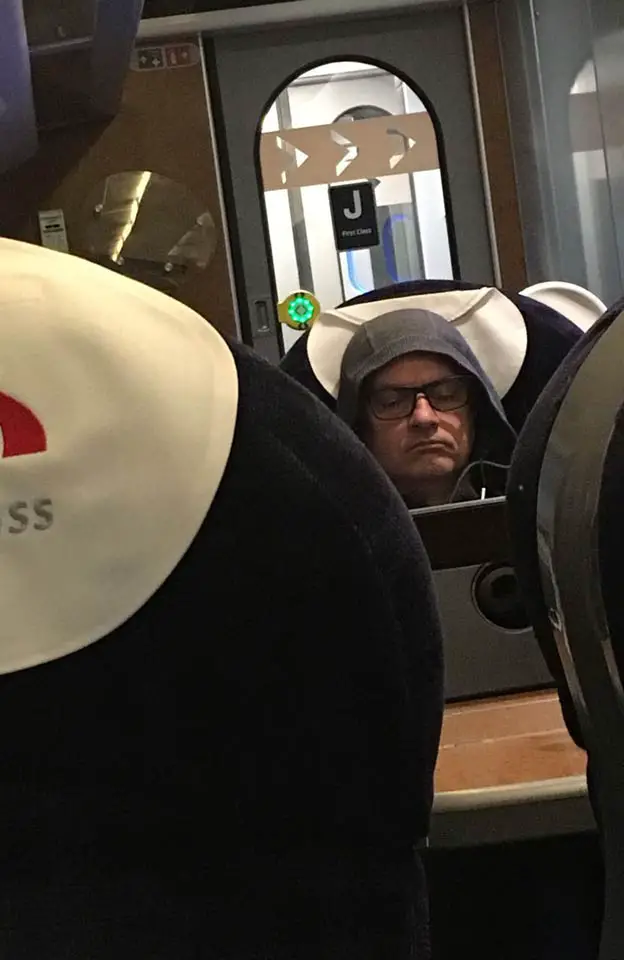 Manchester United boss José Mourinho hid under a hoodie wearing reading glasses on a Virgin train © Atlantic Images