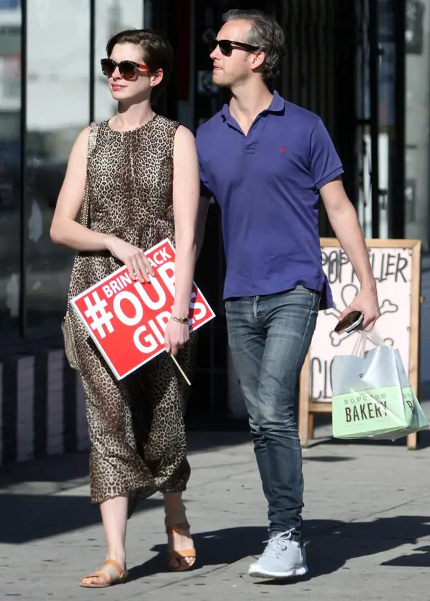 Anne Hathaway wore a leopard print dress with her husband Adam Schulman as she supported the #bringbackourgirls campaign