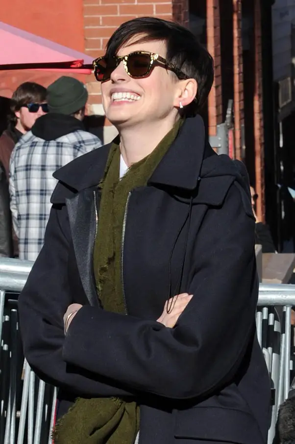 Anne Hathaway just couldn't stop smiling in her leopard patterned sunglasses as she promoted her new film at The Sundance Film Festival