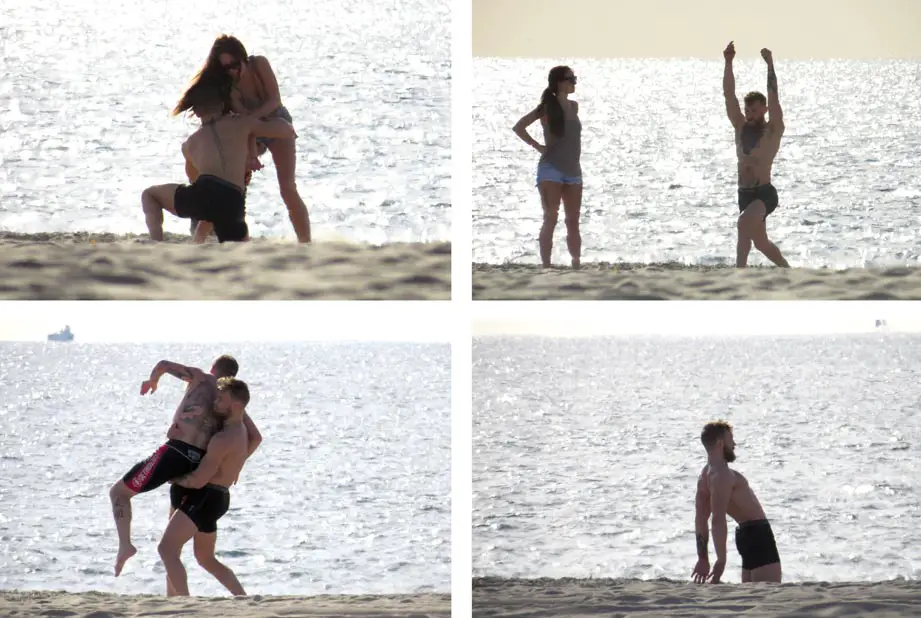 Conor McGregor wrestled with Dee Devlin on Venice Beach and also a trainer and did his stretches © Atlantic Images
