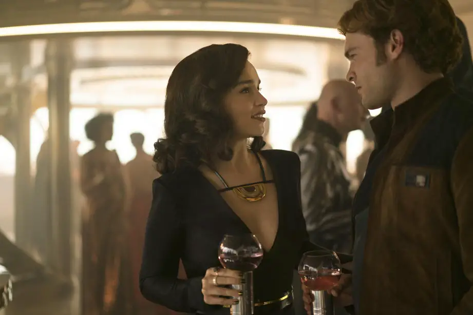 Solo: A Star Wars Story Stills Emilia Clarke plays Qi-ra and shares a drink with Han Solo who looks less than impressed