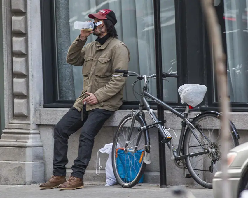 Keanu Reeves looked almost unrecognizable as he sipped on a drink in Toronto, Canada