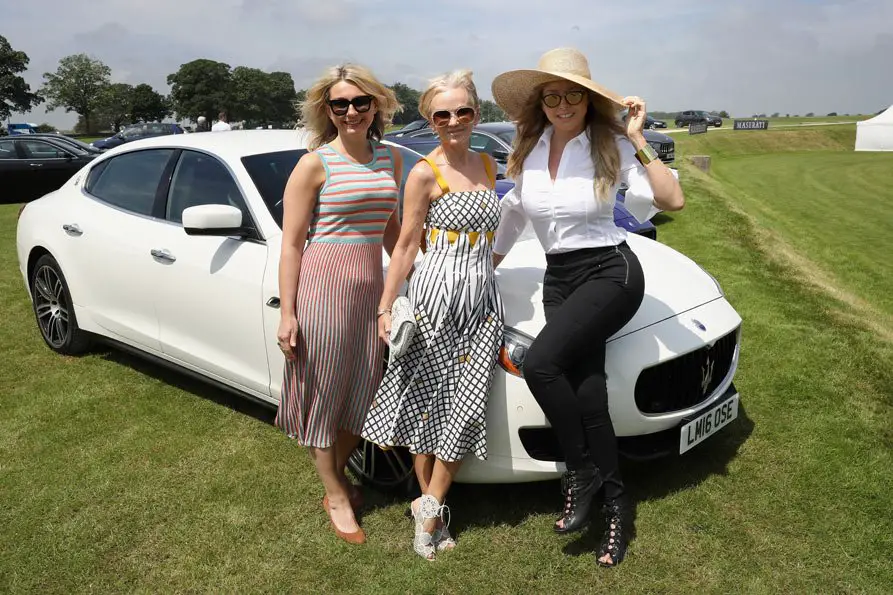 Carol Vorderman sported quite the hat with Lisa Maxwell and guest with the Maserati Quattroporte attend the Maserati Royal Charity Polo Trophy 2018 at Beaufort Polo Club