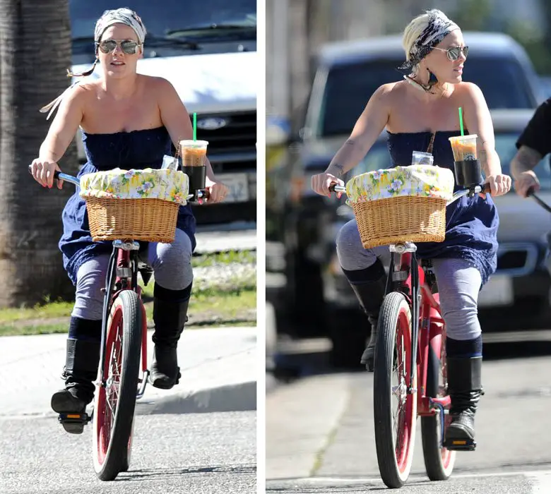 Pink's bike had a wicker basket on the front showing off her tattoos on her right arm © Atlantic Images