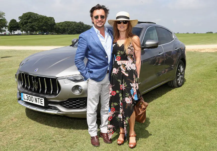Richard Hammond poses with wife Mindy Hammond in front of the Maserati Levante SUV - Photo by Chris Jackson / Getty Images for Maserati / La Martina