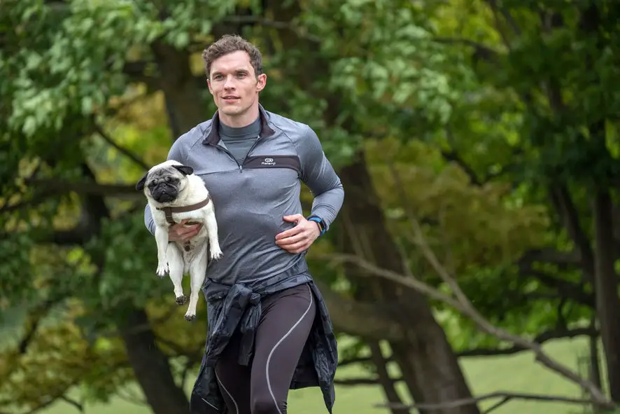 Ed Skrein was the man for the role of veterinarian Oliver seen here jogging with his buddy Patrick, played by Harley the Pug! Picture courtesy of Disney / Image.net