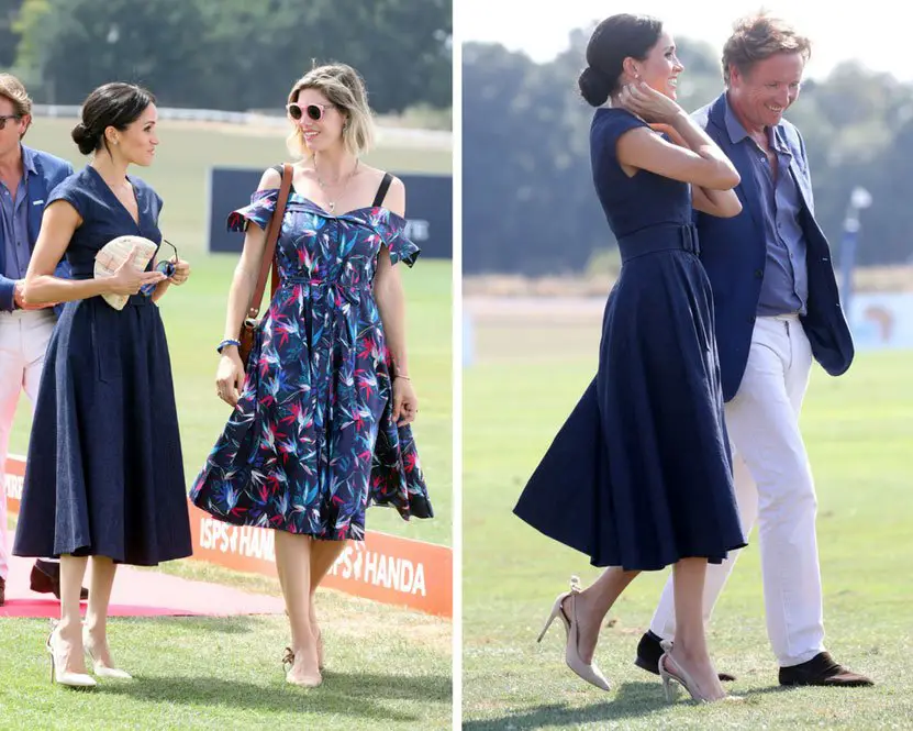 Meghan Markle fashioned a navy Carolina Herrera dress chatting to Delfina Figueras and Johnny Hornby - Photo courtesy of Image.net / Chris Jackson / Getty Images