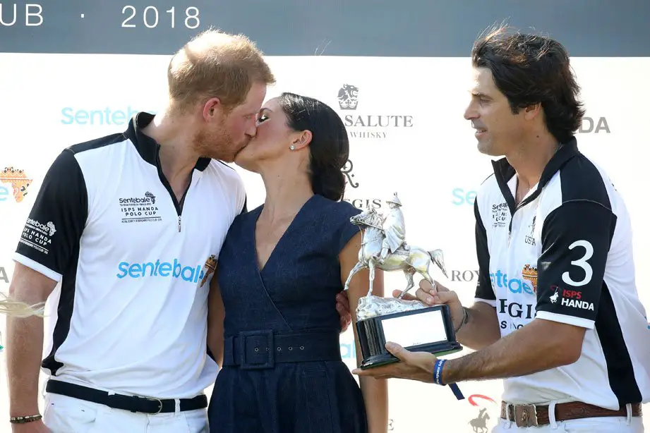 Photobombed! Nacho Figueres accidentally got in the frame for the royal smooch! - Photo courtesy of Image.net / Chris Jackson / Getty Images
