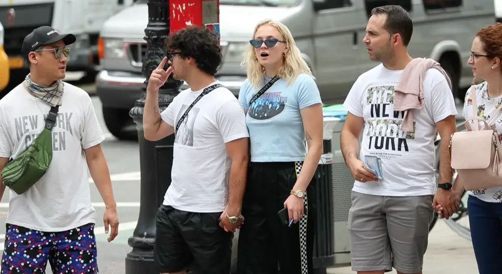 Sophie Turner held hands with Joe Jonas and showed off her new infinite triangle tattoo on her upper left arm in NYC © The MEGA Agency