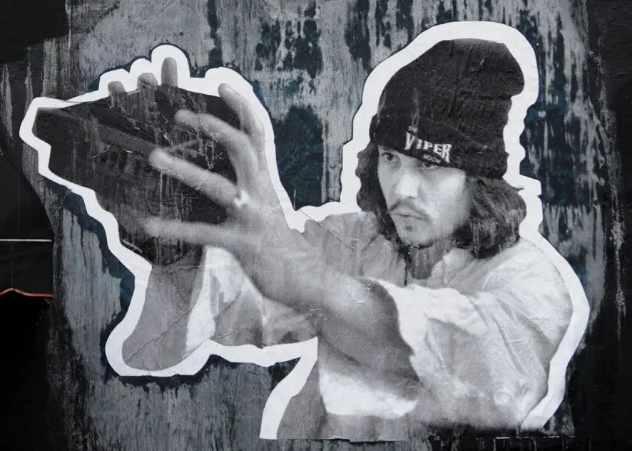 Johnny Depp wears a black beanie with The Viper Room' written across it on this cool poster