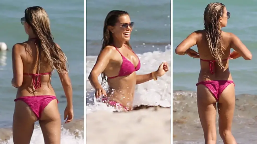 Sylvie Meis shows off her pink bikini as she enjoys a dip in the Miami Beach ocean © The Mega Agency