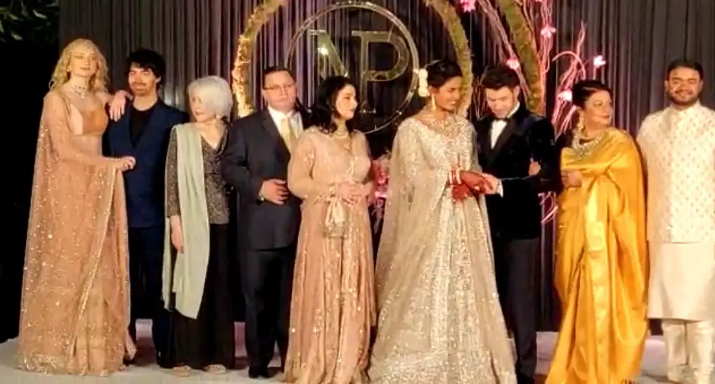 Say cheese! Both families were in India to pose for the traditional family snap © The Mega Agency