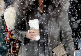 Demi Moore braves the snow carrying a Starbucks coffee in wintery Utah © Atlantic Images