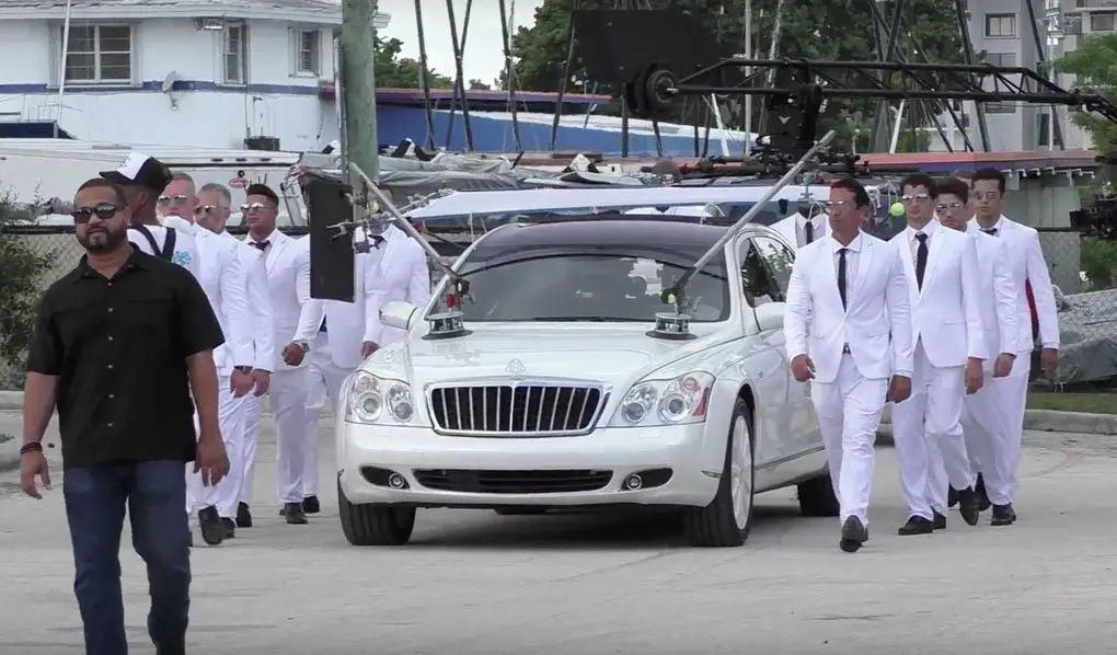 Now that's an entrance! JLo arrives in a white Maybach with 10 bodyguards dressed in white! © Atlantic Images