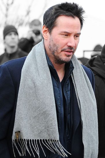 Keanu Reeves looked dapper in his grey scarf and smart winter jacket © Atlantic Images
