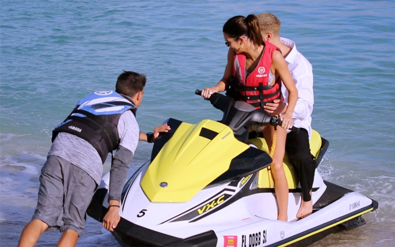 Hang On! Fai Khadra grabbed on to Kendall Jenner's waist in her bikini thong © The MEGA Agency