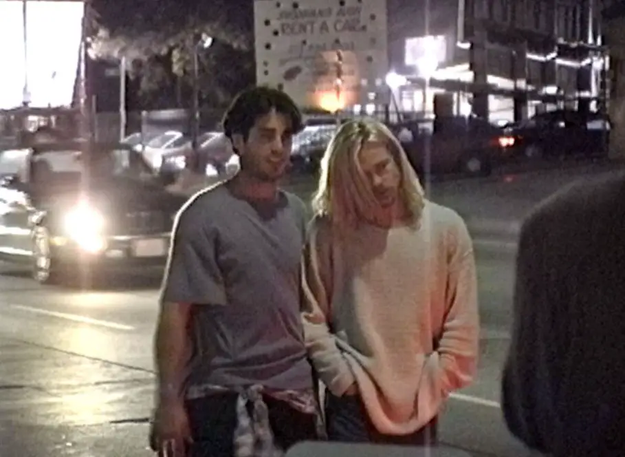 Brad Pitt had his blonde hair down as he walked with a male friend on Sunset Boulevard