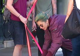 Lady Gaga pets her French Bulldogs Gustav and Miss Asia with their dog walker in Vancouver, Canada