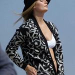 Mischa wrapped up in a star-studded cardigan revealing her cleavage in her white bikini © Atlantic Images Mischa Barton strips off for a sexy bikini shoot in Santa Monica!