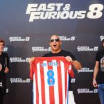 Check me out! Vin diesel looked delighted as he showed off his new Atletico Madrid squad number to coincide with the 8th Fast & Furious film © Atlantic Images Charlize Theron in Gucci and Vin Diesel were delighted to “sign” for Atlético Madrid as the two Fast & Furious: Fate of the Furious stars were presented with the red and white soccer shirts in Madrid, Spain by Antoine Griezmann and Filipe Luis
