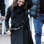 Selena Gomez played with her hair wearing a Versace Fall Trench Coat at the Sundance Film Festival © Atlantic Images Selena Gomez Versace Fall Trench Coat Sundance © Atlantic Images