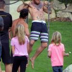 Conor McGregor works on his arms and core with a crowd watching the champion complete his workout routine © Atlantic Images Conor McGregor Workout Routine Pull Ups Ring Work
